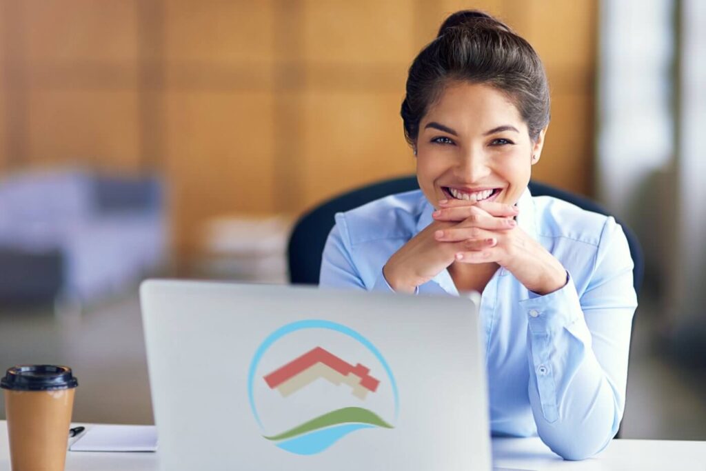A US property tax accountant smiling. Here you will find everything you need to know about US Tax Filing for Nonresident Landlords.