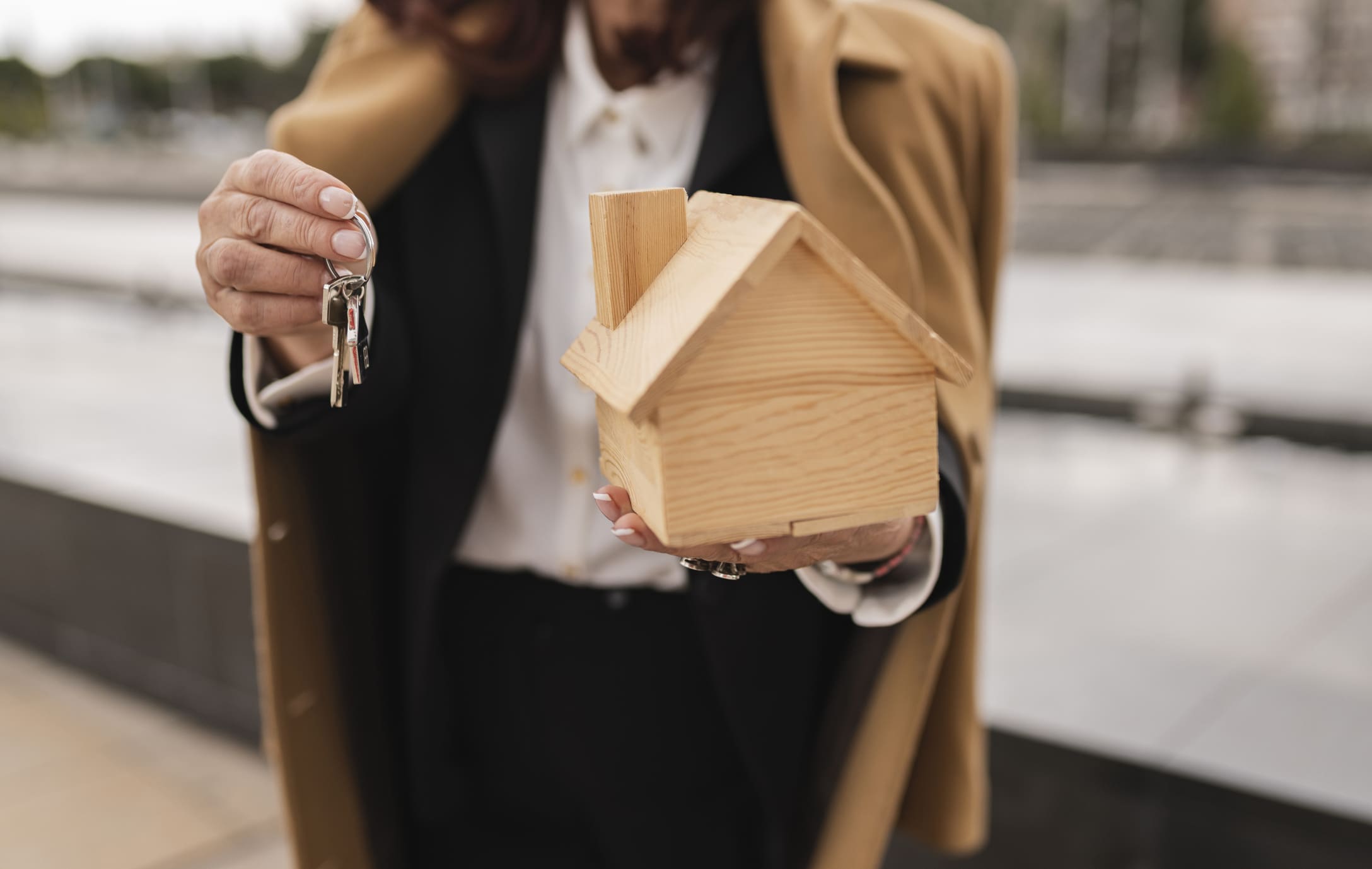 Property management agent holding keys