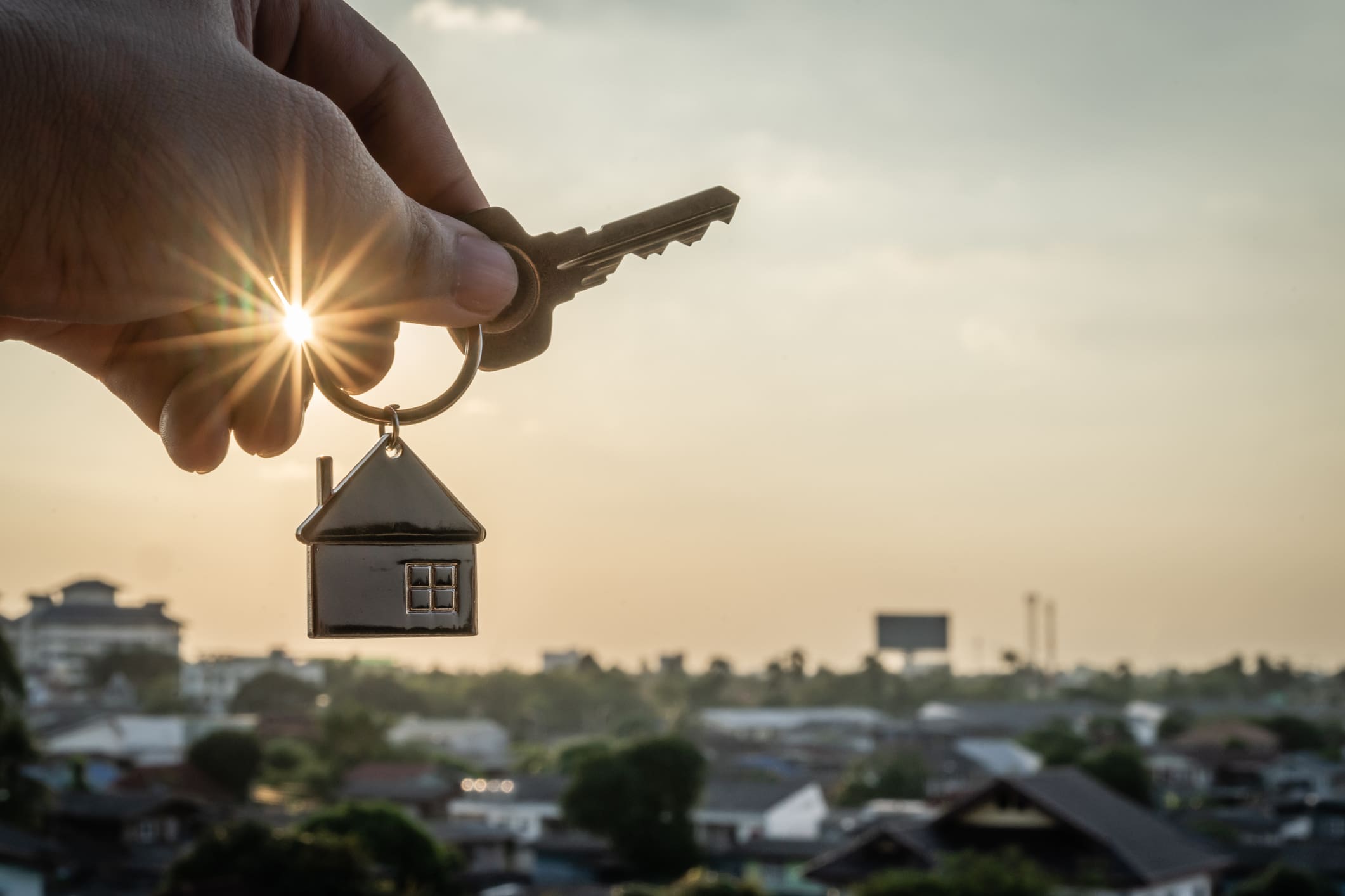 Tax advice for AirBnb hosts. A hand of a property manager with keys