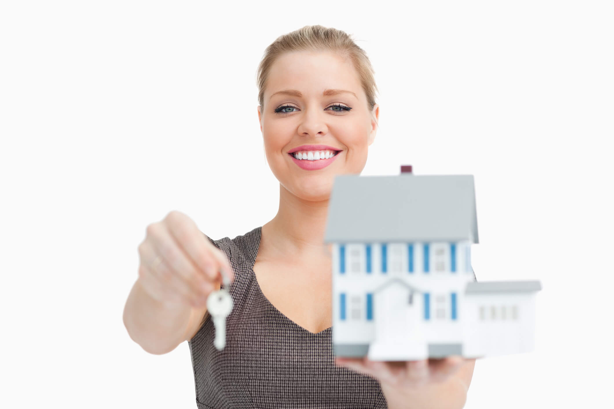 Rent collection agent handing over property keys to manage rental income for a non-resident landlord.